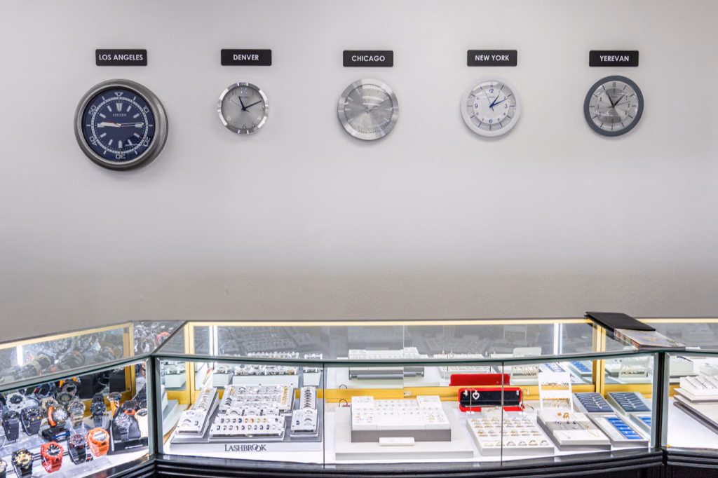 World time zone clocks on the wall at Prestige Watches & Jewelry